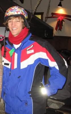Seth Voege wearing his Swiss Valley ski instructor jacket and helmet